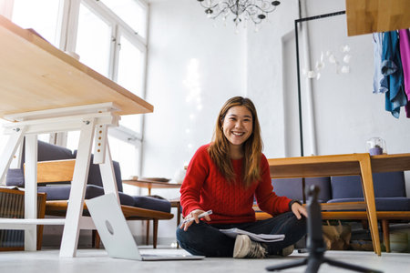 Young female vlogger making social media videoの写真素材