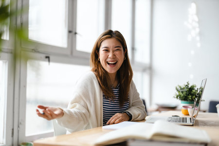 Image of a beautiful young asian business woman indoors in office.の写真素材