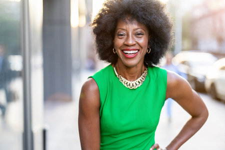 Portrait of a beautiful young african american woman smiling outdoorsの写真素材