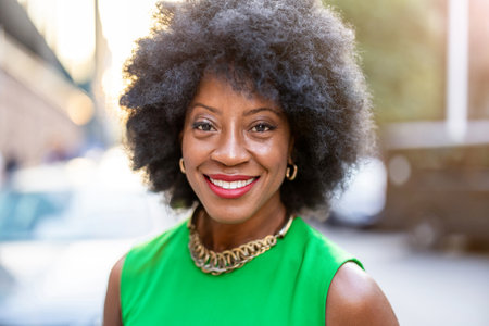 Portrait of a beautiful African American woman with curly hairの写真素材