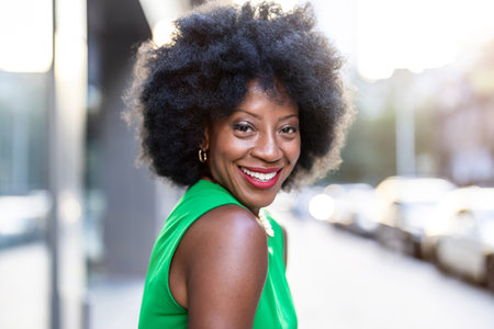 Portrait of a beautiful young African American woman in green dressの写真素材