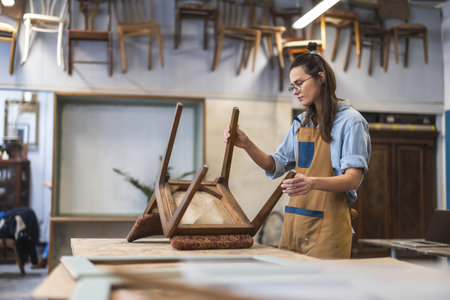 Portrait of young female artist working in art studioの写真素材
