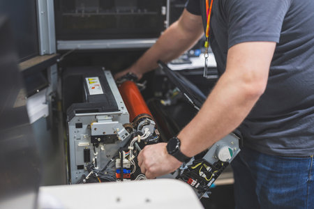 Technician repairing a power supply system in a power supply station.の写真素材