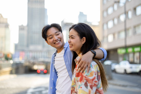 Young asian couple embracing each other in New York City, USAの写真素材