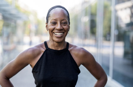 Portrait of smiling african american woman in sportswearの写真素材