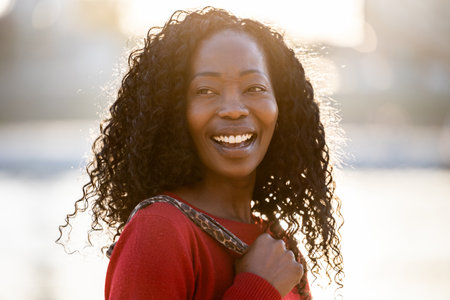 Close up portrait of a beautiful young african american woman smilingの写真素材