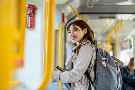 Young woman traveling and using mobile phone in the city.の写真素材