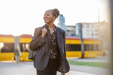 Portrait of a smiling senior businesswoman standing in the cityの写真素材