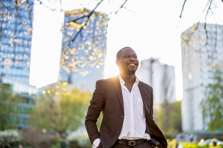 Portrait of a smiling young African American businessman in the cityの写真素材