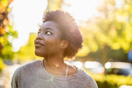 Portrait of a young African American woman in the parkの写真素材