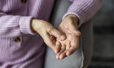 Closeup of senior woman holding her hands. Elderly people conceptの写真素材