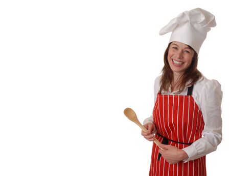 attractive female chef in red apron smiling, isolated on whiteの写真素材