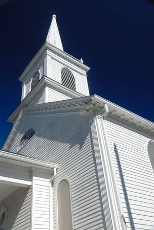 wooden church spire against deep blue sky, verticalの写真素材