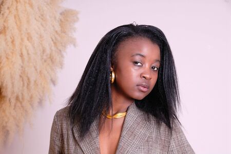 portrait of attractive young African girl in business suitの写真素材