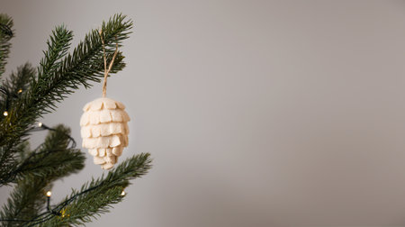 Pine cone toy for fir tree made of natural materials. Zero waste christmas concept.Banner with place for textの写真素材