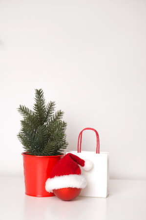 Vertical banner with christmas tree,ornamnets,santa hat and paper bags.Shopping and sales conceptの写真素材
