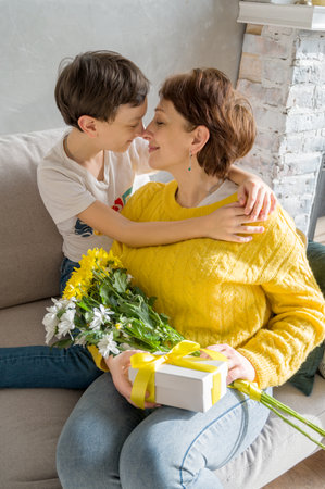 Vertical shot of happy mother and son. mother's day cardの写真素材