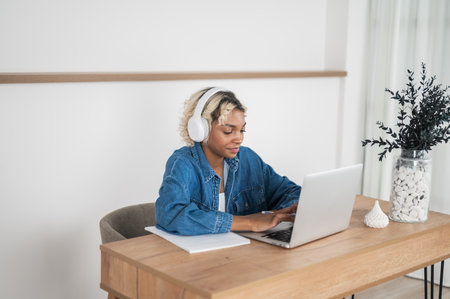 Unhappy,annoyed young adult typing on laptop. Burnout, exhausted student etc