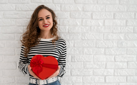 women's DAY,VALENTINE'S,anniversary banner with place for text.Happy woman holding presentの写真素材