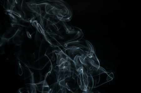 Smoke is a collection of airborne solid and liquid particulates and gases emitted when a material undergoes combustionの写真素材