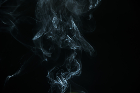 Smoke is a collection of airborne solid and liquid particulates and gases emitted when a material undergoes combustionの写真素材