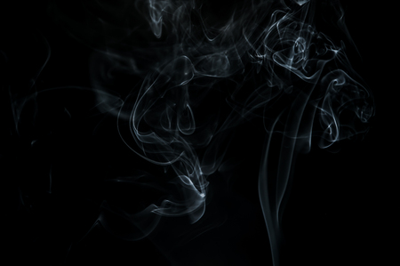 Smoke is a collection of airborne solid and liquid particulates and gases emitted when a material undergoes combustionの写真素材