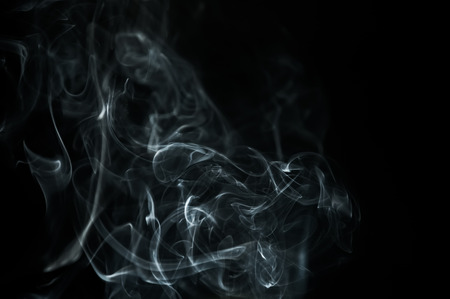 Smoke is a collection of airborne solid and liquid particulates and gases emitted when a material undergoes combustionの写真素材