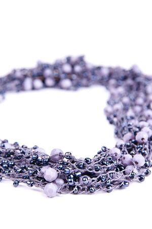 grey elegant necklace on white background in studioの写真素材