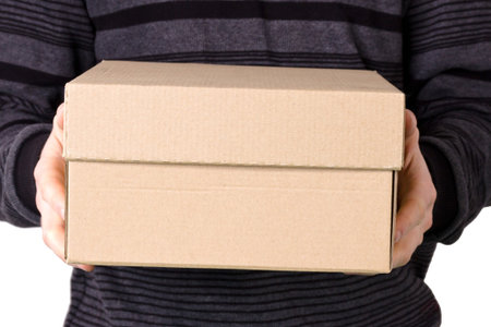 cardboard brown box in hands for a man