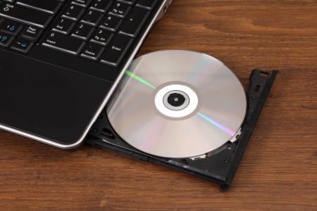 the new DVD disk cutting-in in a notebookの写真素材