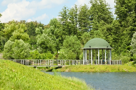 beautiful summer park with a rotunda and pathsの写真素材