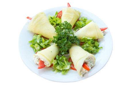 pancakes with curd and pepper, on a dish, decorated parsleyの写真素材