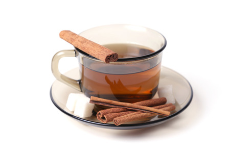 cup of tea with sugar and cinnamon on a white backgroundの写真素材