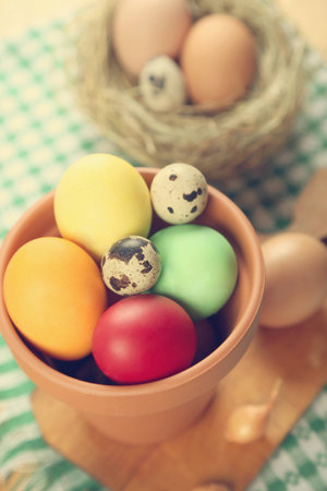 few colored chicken and quail eggs for the Easterの写真素材