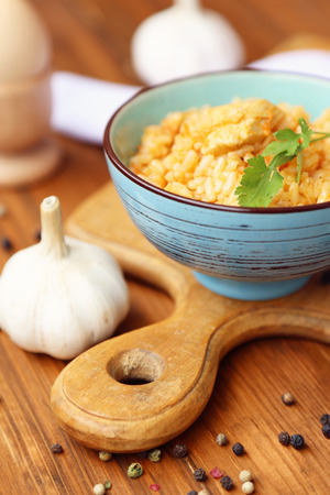 fresh pilau in a bowl with a garlic, in a studioの写真素材