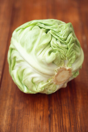 fresh green cabbage on wooden backgroundの写真素材