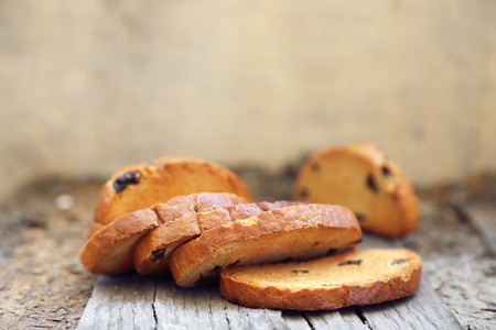 few rusks with a raisin on a wooden backgroundの写真素材