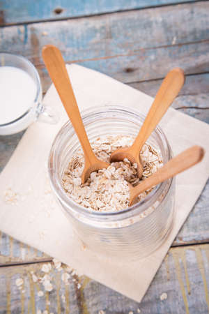 oat flakes with milk in a bowl on textile in studioの写真素材