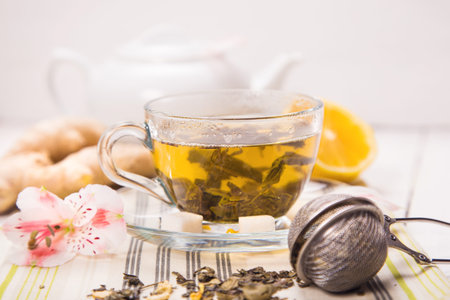 green fresh tea with a ginger, sugar and flowerの写真素材