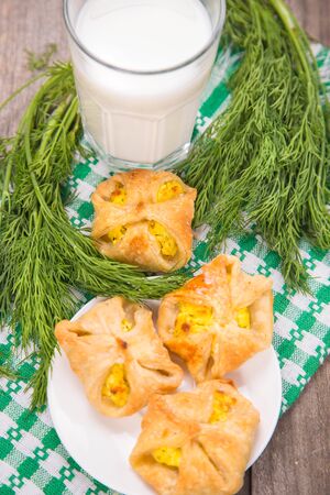 not sweet cookies with cheese and dill, and milk, in a studioの写真素材