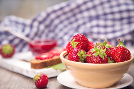sandwich with fresh ripe raw strawberry and jam in studioの写真素材
