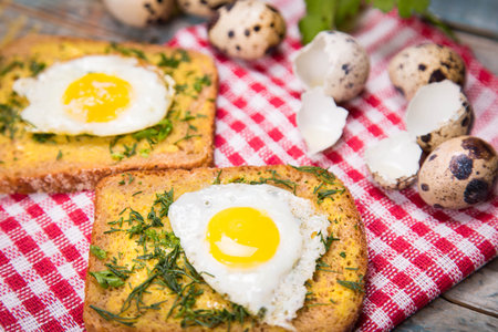 fried eggs on wooden plate with bread,oil in studio