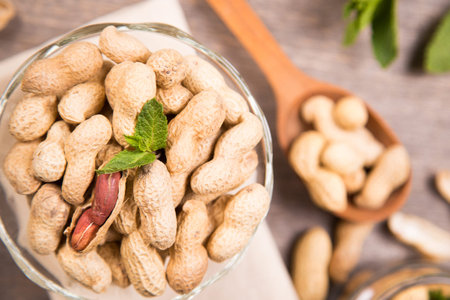 ripe peanut with more fresh mint in a glass container