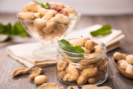 ripe peanut with more fresh mint in a glass container