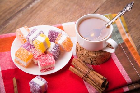 many marmalade candys with fresh tea in studioの写真素材