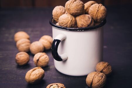 many walnut on wooden background in studioの写真素材