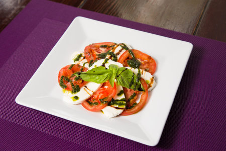 vegetarian fresh salad with tomatoes,basil and cheese with sauce