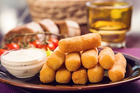 set of different cheese with mint and honey on wooden plateの写真素材