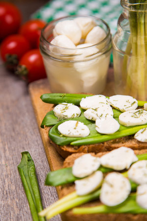 sandwich with mozzarella,ramson and tomatoes in studioの写真素材