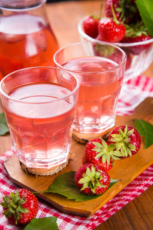 fresh hot strawberrys compote with ripe red strawberry on wooden backgroundの写真素材